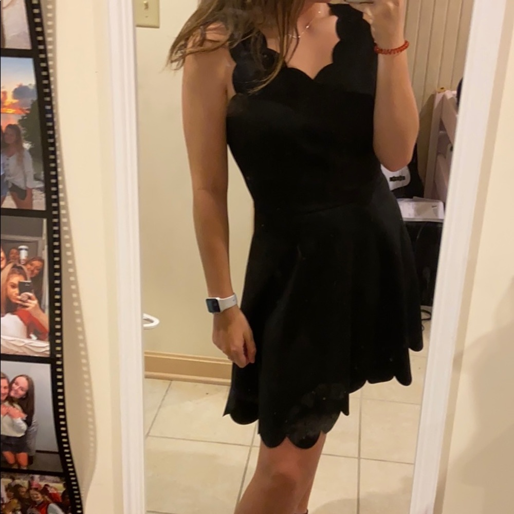 black scallop cut dress